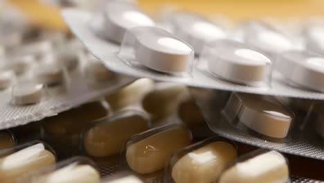 close-up of various pills and capsules in blister packaging