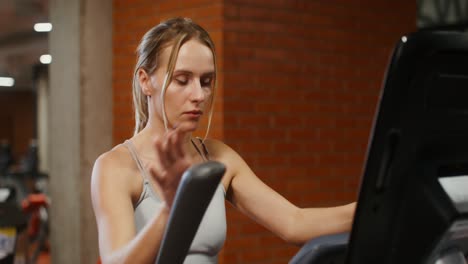 woman exercising on a treadmill in a gym