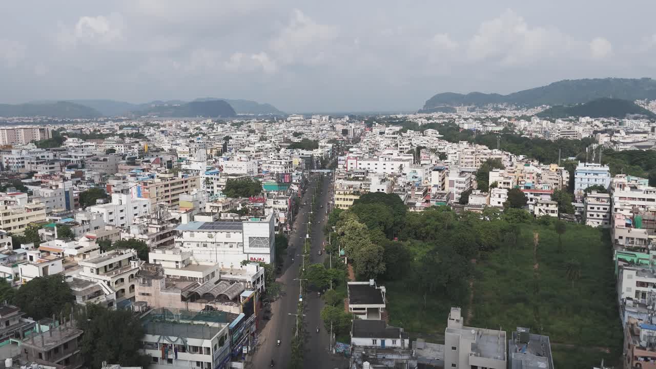 Modern infrastructure in Vijayawada with high-rise buildings and highways.