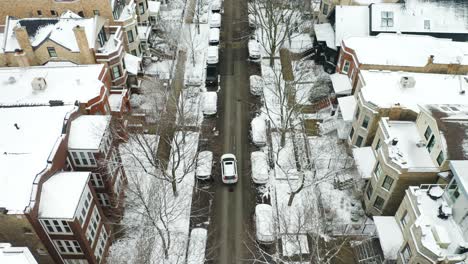 aerial, unrecognizable people getting into car during winter
