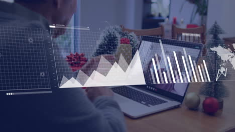 analyzing financial charts and graphs animation over person using laptop at home