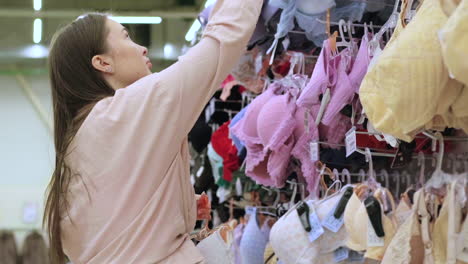 woman shopping for bras in a lingerie store