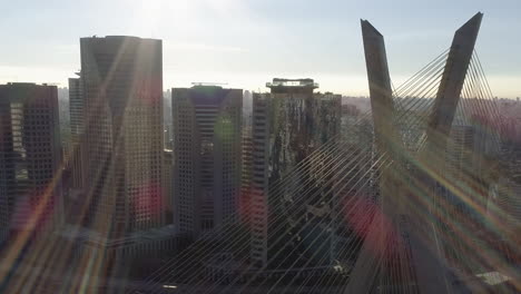 Aerial-view-to-Estaiada-bridge,-Pinheiros-river-and-the-buildings-in-background,-Sao-Paulo,-Brazil