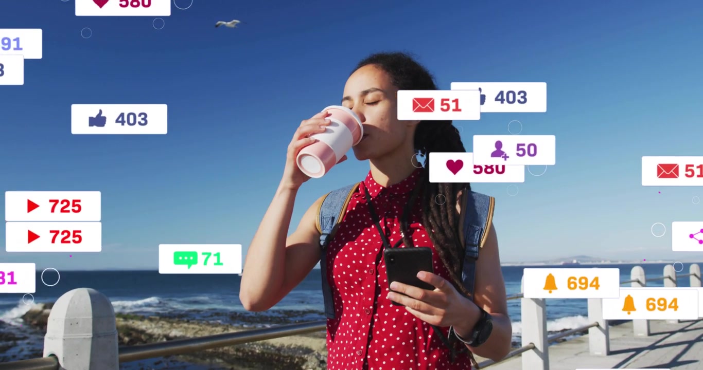 Woman checking phone on sea, social icons swelling around her then thinning while monitoring likes