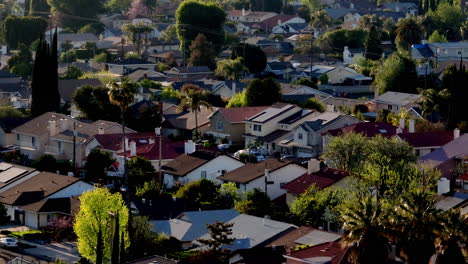 medium aerial pan across downtown los angeles california suburban apartment homes