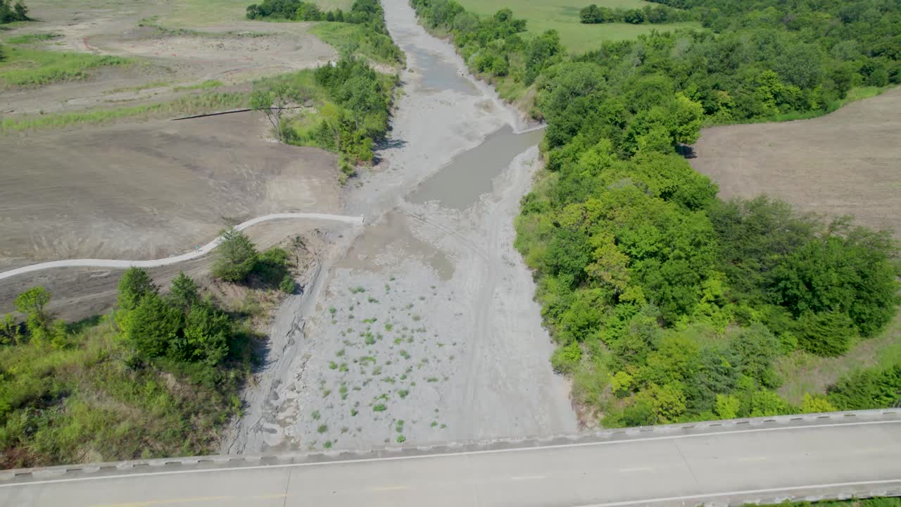 Aerial video of the Sulphur River and 904 bridge in Ladonia, Texas. Camera is flying approximately west and crosses over the 904 bridge