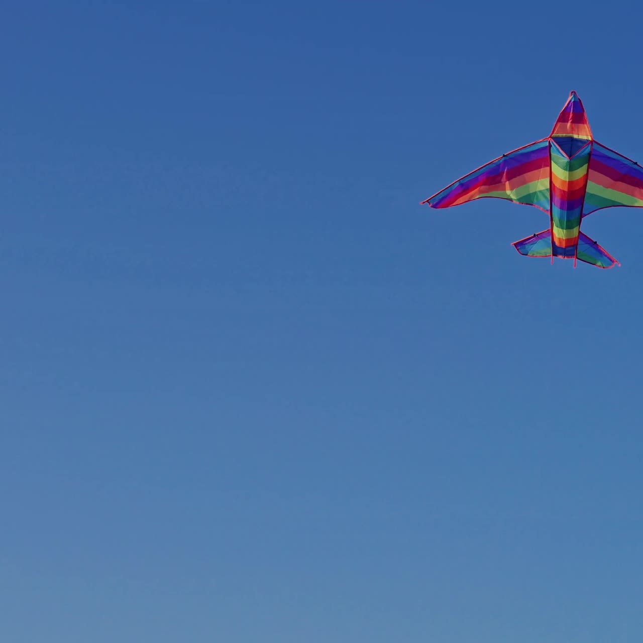 Kite flying against blue sky