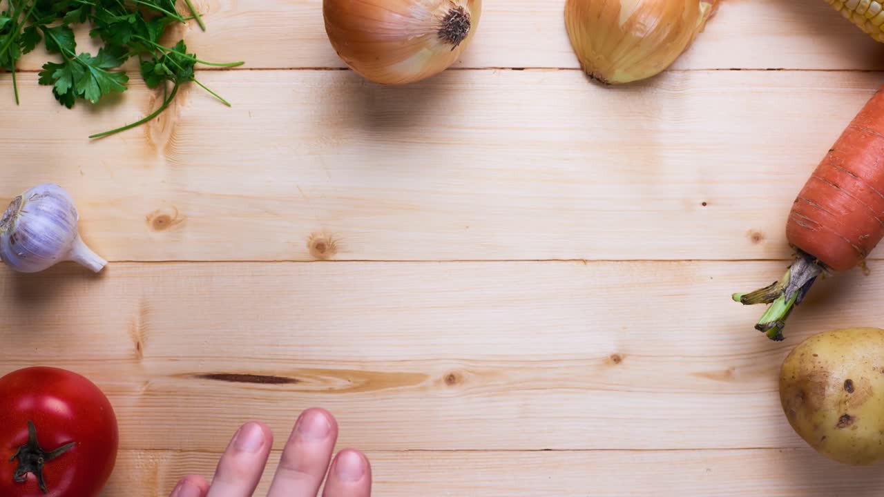 Preparing fresh vegetables on a wooden table