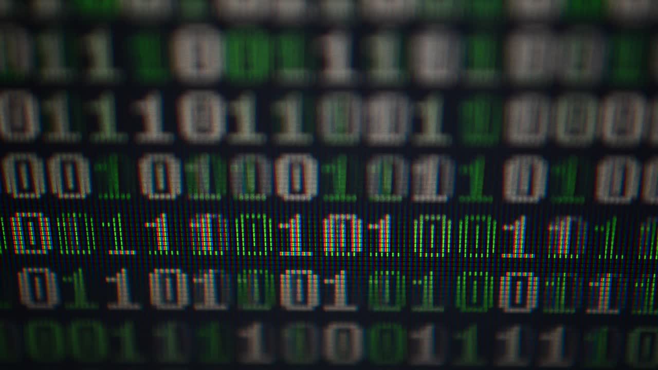 Binary code on the monitor screen. Shooting of a binary code, background