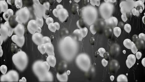 black and white balloons flying on black background endless loop