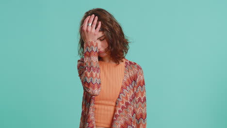 young woman making face palm gesture feeling bored disappointed in result bad news sorrowful