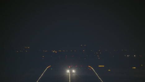 nighttime takeoff with bright lights