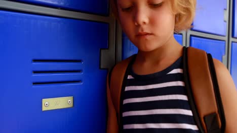 schoolgirl using mobile phone in locker room 4k