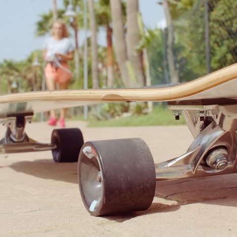 Longboard-Resting-on-the-Ground-at-the-Street