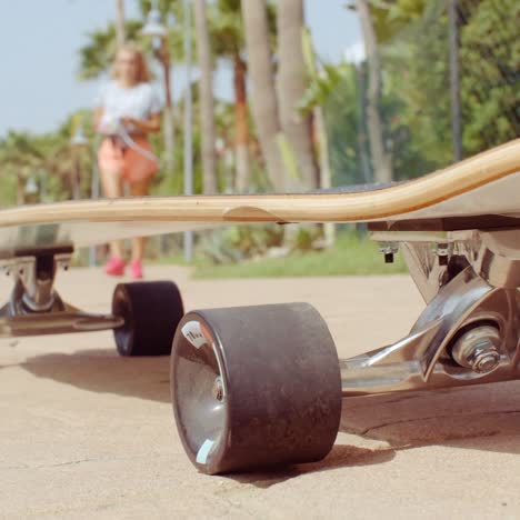 longboard resting on the ground at the street