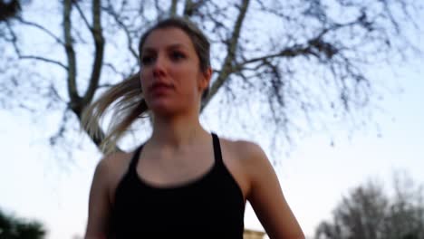 young female athlete with ponytail cardio training outdoor, close up