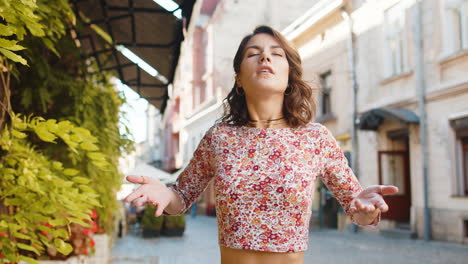 woman taking a deep breath of fresh air, relaxing, taking a break, resting, meditating outdoors