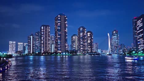 Night-light-Tokyo,-Tsukuda,-Toyosu-skyscrapers-and-bridge-The-Sumida-River-Yakatabune,-pleasure-boat