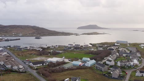 a wide, point-of-interest drone shot of castlebay and the surrounding area