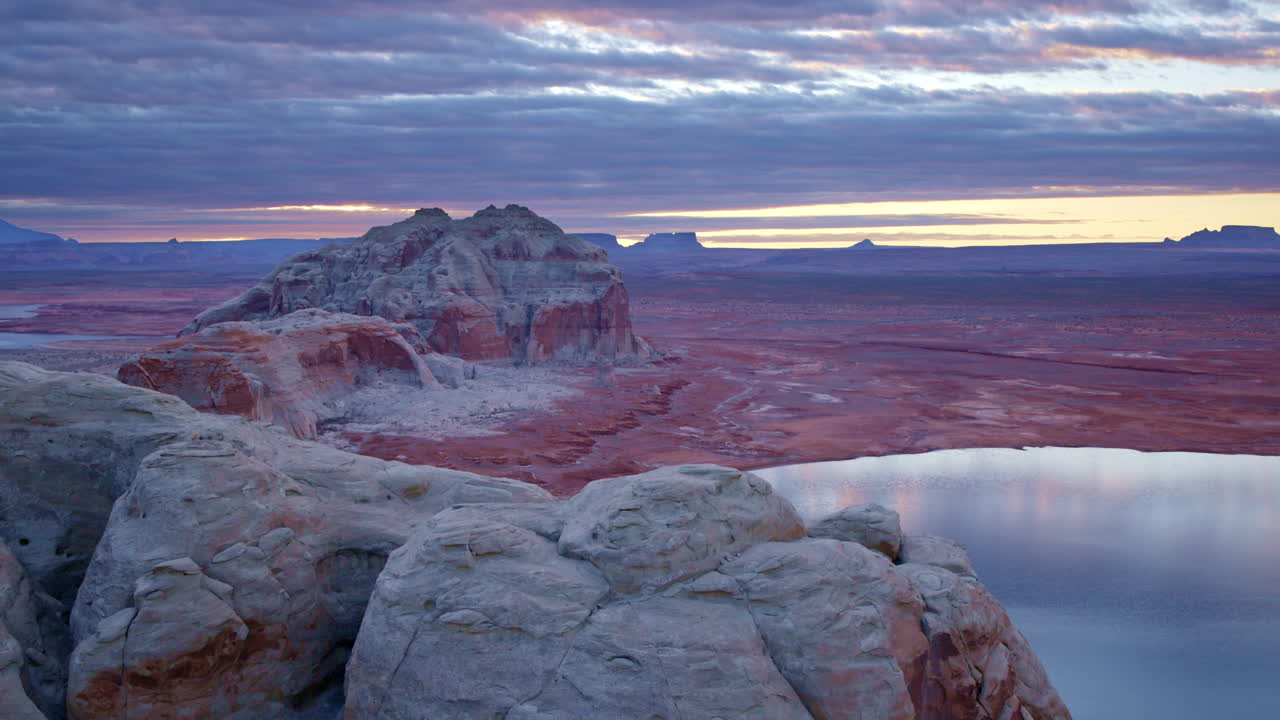 The drone gracefully circles the towering sandstone formations of Glen Canyon, showcasing its natural beauty.