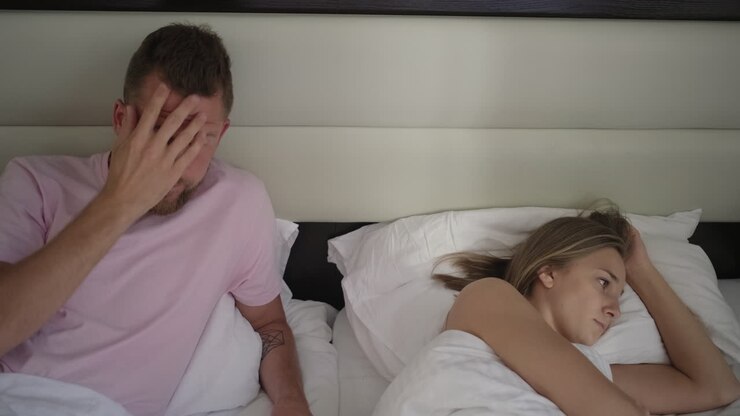 Couple Arguing in Bed