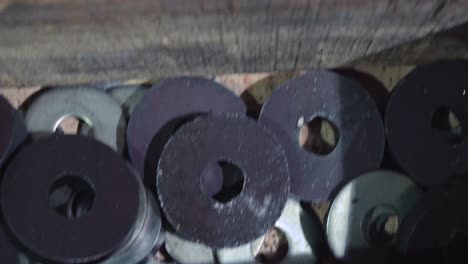 assorted metal parts in a wooden crate