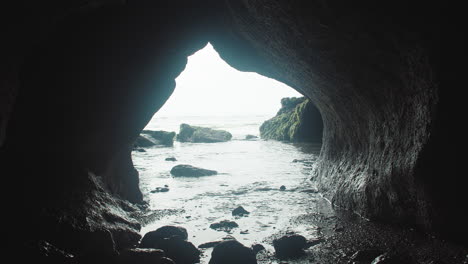 a view of calm waters through a rocky cove in indonesia bali, static wide