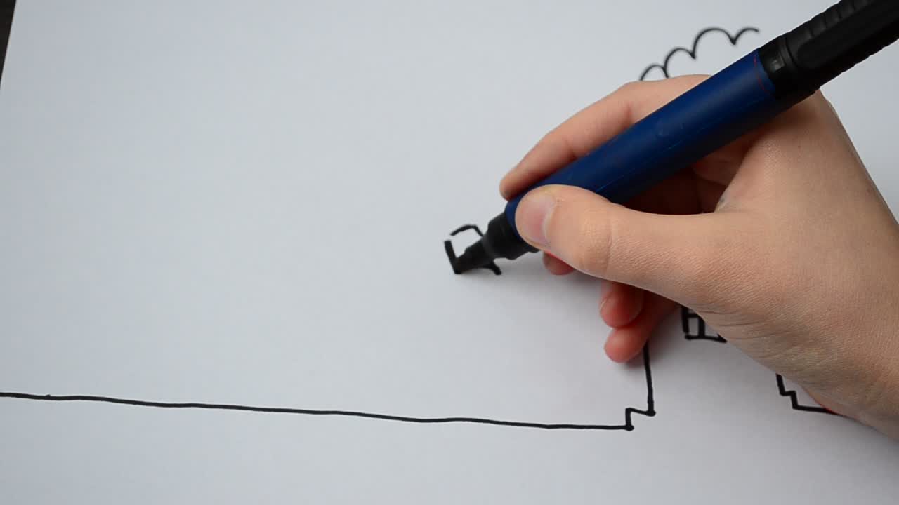 Il costruttore disegna davanti alla casa. Processo di disegno