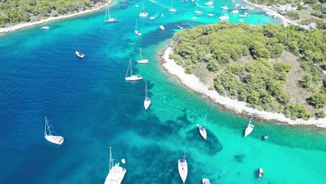 aerial view of yachts and boats docked at the scenic paklinski islands near hvar, croatia