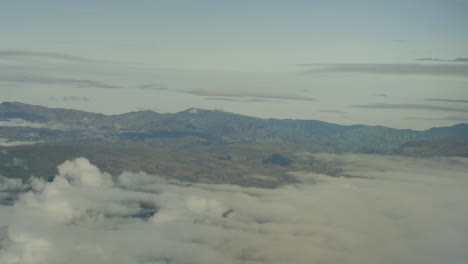 aerial view from plane, clouds and mountains