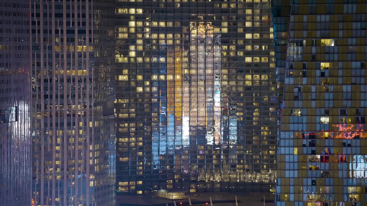 Illuminated Facades of Modern Skyscrapers at Night