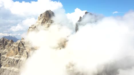 aerial of the mountain tops of three peaks at national park tre cime di lavaredo, belluno, dolomite, italy