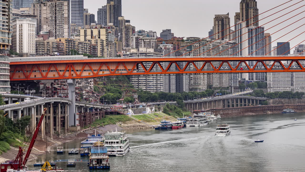 Timelapse of the amazing Chongqing cyberpunk city skyline from a high vantage point wirh the yangtze river at sunset