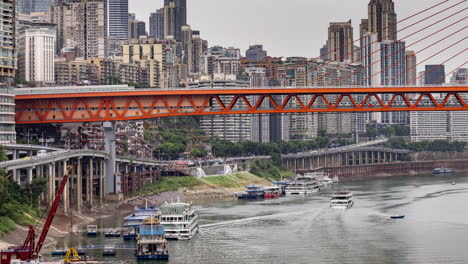 timelapse of the amazing chongqing cyberpunk city skyline from a high vantage point wirh the yangtze river at sunset