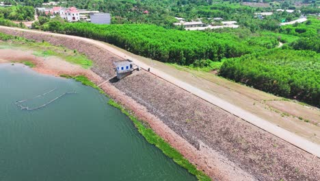 aerial view dolly of the dam and the farms in dong nai.