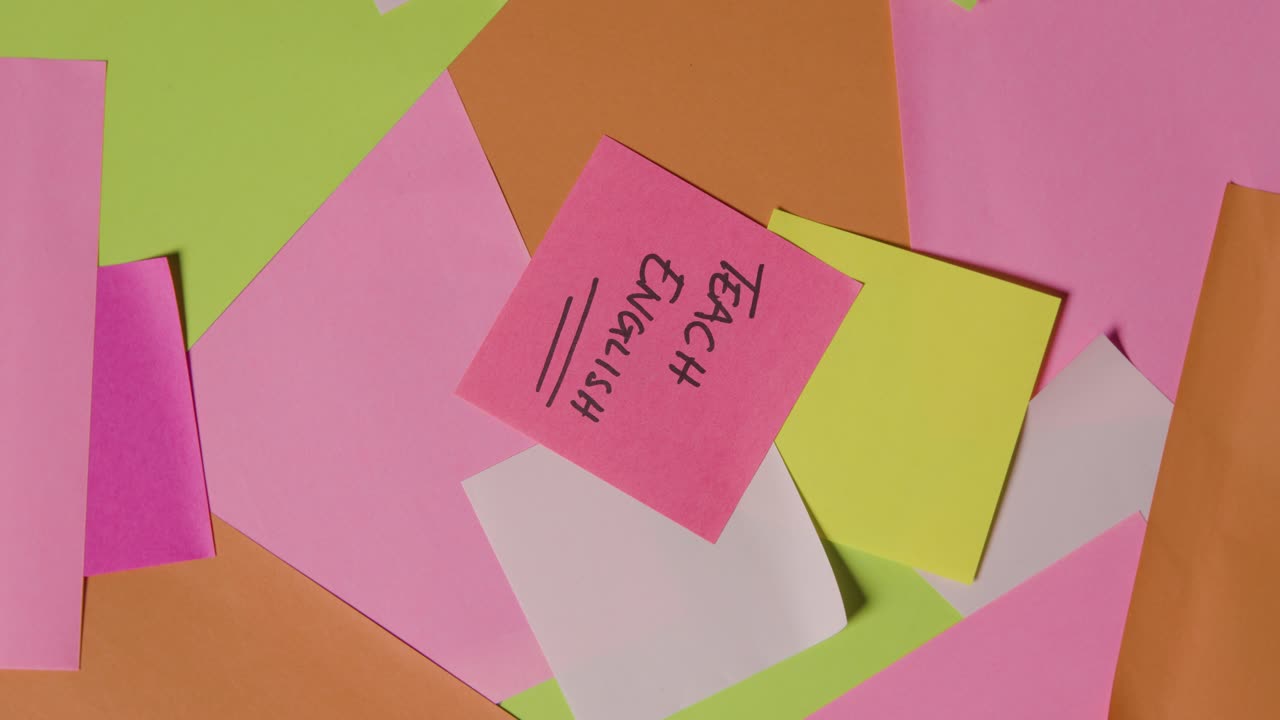 Education Concept Of Revolving Sticky Notes With Teach English Written On Top Note