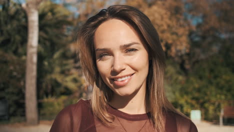 young woman with blue eyes outdoors.