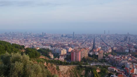 slow sweeping panorama of the city of barcelona seen from the bunkers del carmen view point