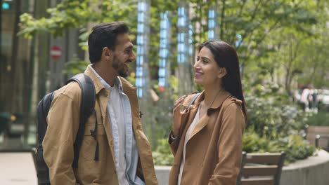 muslim couple on date talking together on city street 1