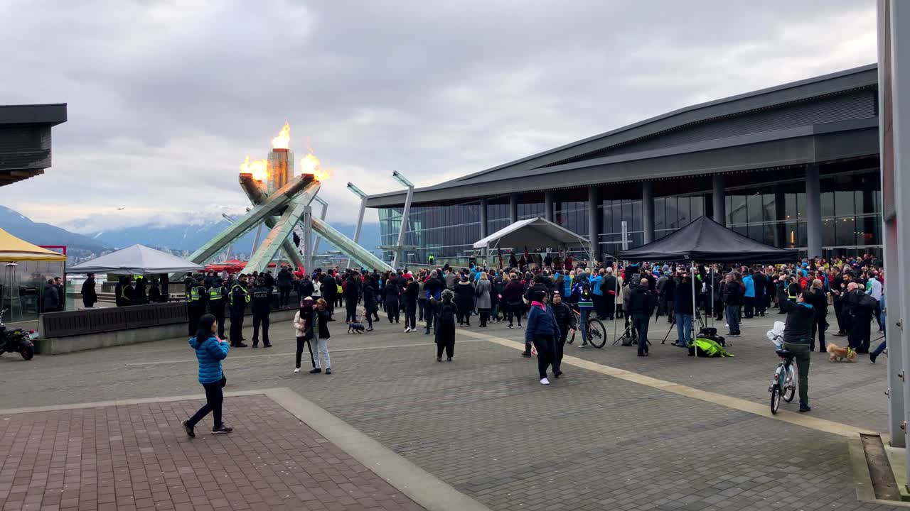 Large crowds gather around the Vancouver Olympic Cauldron for the ten anniversary celebration