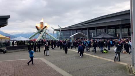 large crowds gather around the vancouver olympic cauldron for the ten anniversary celebration