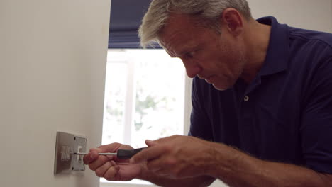 Electrician-Repairing-Domestic-Light-Switch-Shot-On-R3D