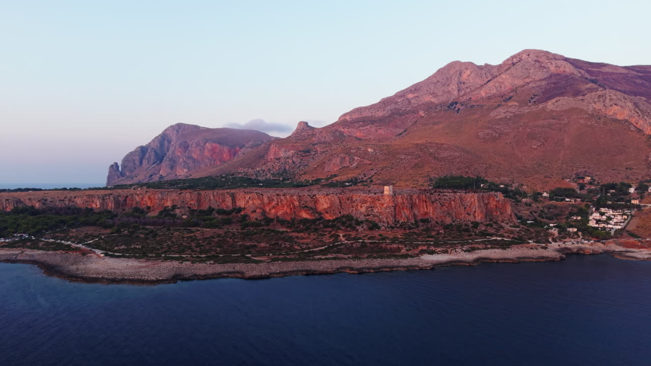 Aerial view of Sicily coastline during sunset, capturing natural beauty
