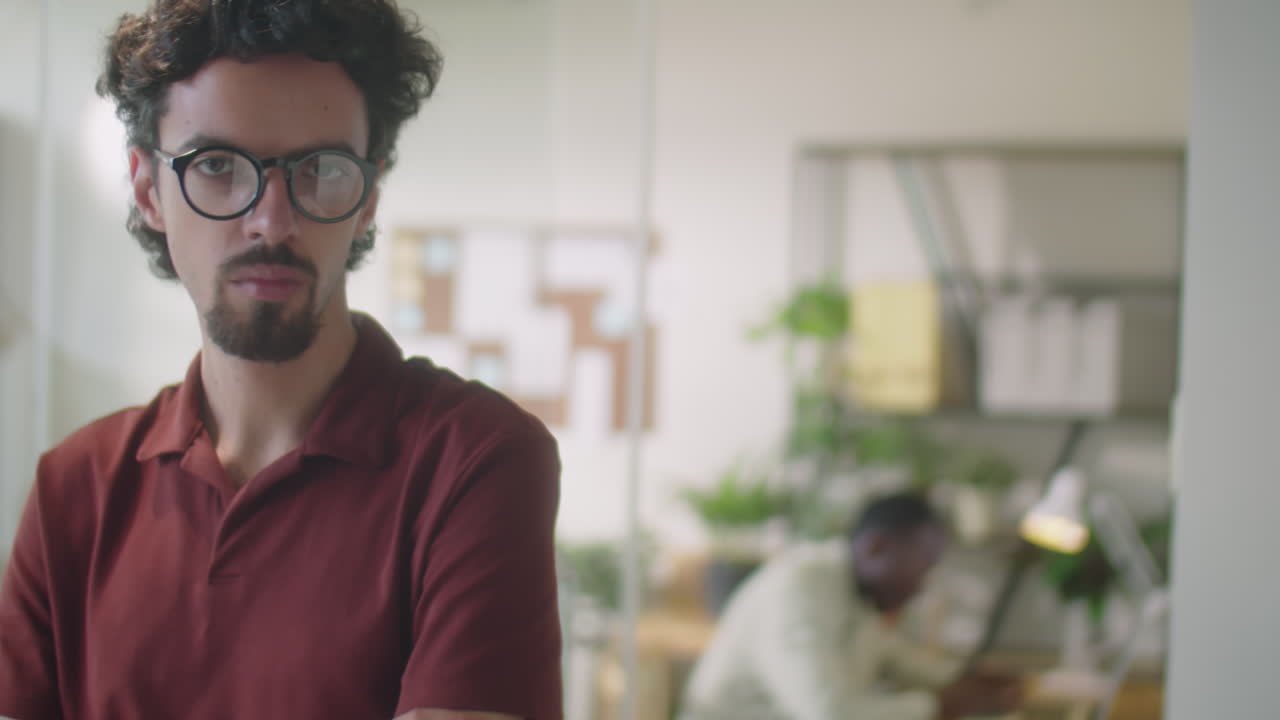 Portrait of Businessman at Work in Office