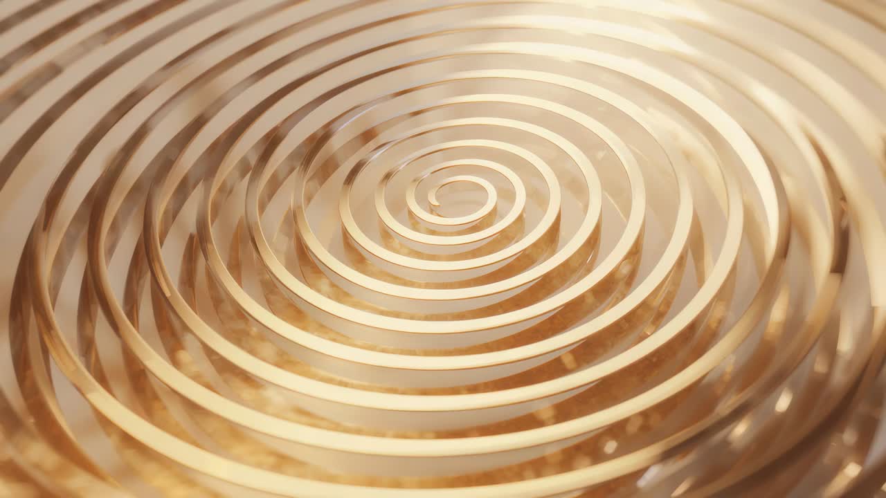 Rotating gold spiral coil following camera pull inward, bringing core into focus over glossy base