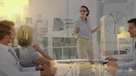 Animation-of-cityscape-over-diverse-business-people-in-office