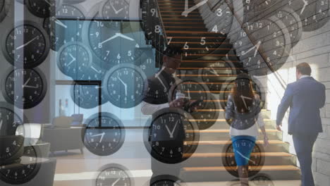 animation of falling clocks with fast hands over caucasian businessman using smartphone in foyer