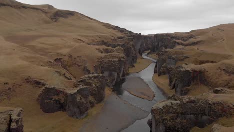 cinematic aerial flyover of stunning icelandic canyon