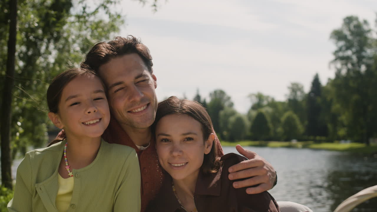 A happy family enjoys a day at the lake