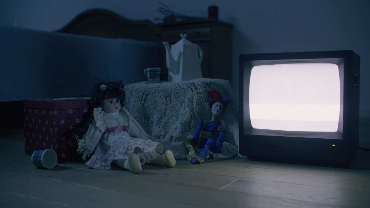 Vintage Dolls and TV in a Dark Bedroom